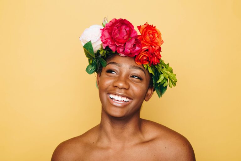Empowered black woman with a flower crown - 15 Self-Love and Motivation Quotes